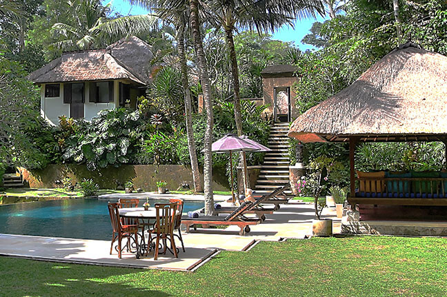 The lawn and pool at Villa Alamanda beside the rice fields near Ubud, Bali