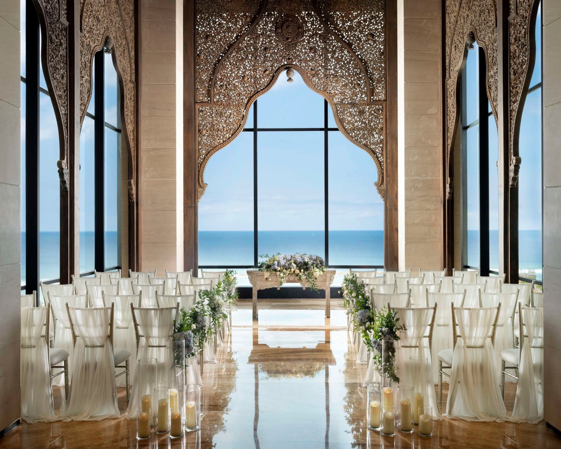 An ocean-view glass cliff chapel at The Apurva Kempinski Bali in Nusa Dua, overlooking the Indian Ocean