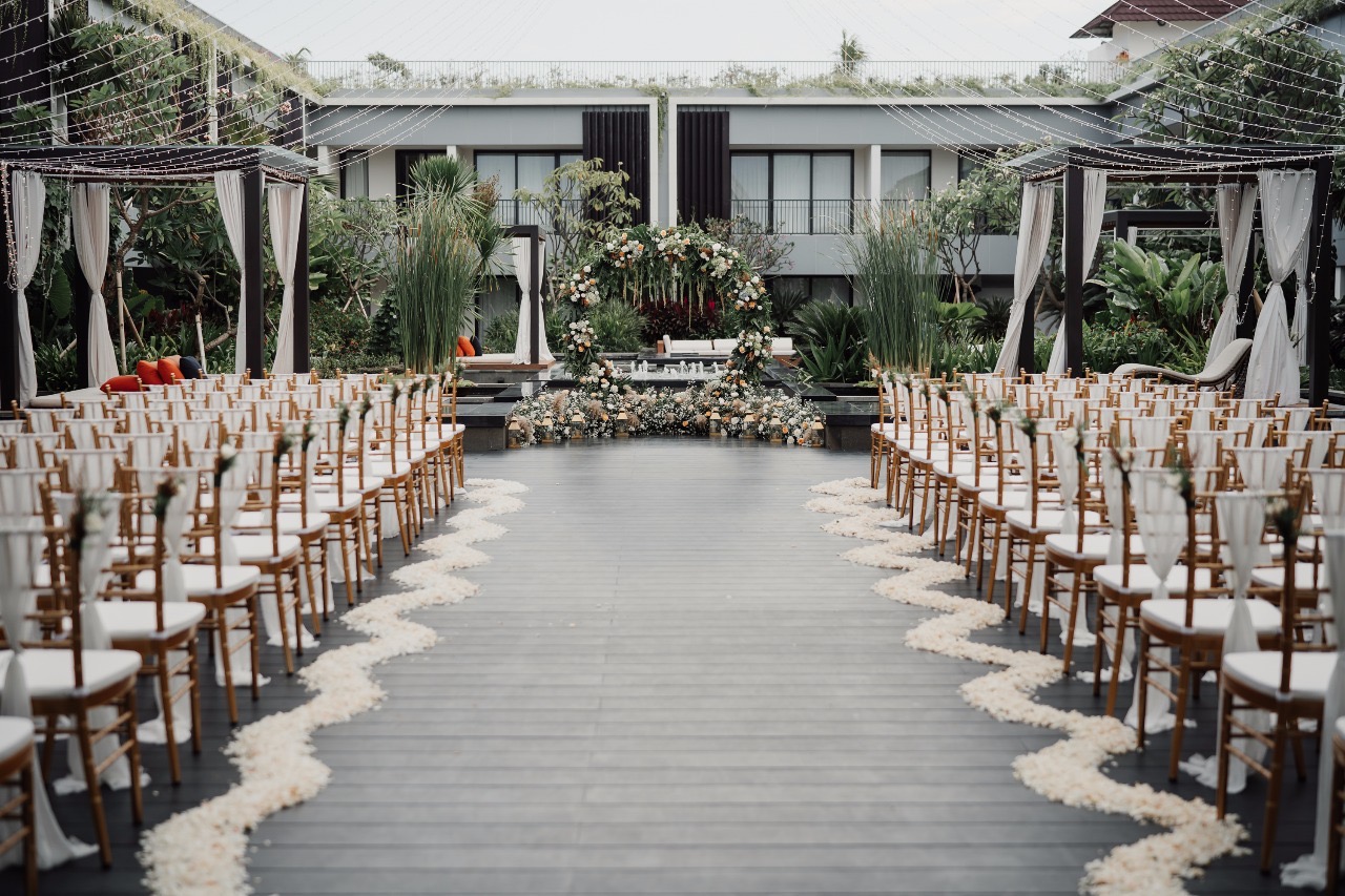 Wedding ceremony setup inside the glass chapel at Aryaduta Bali in Kuta