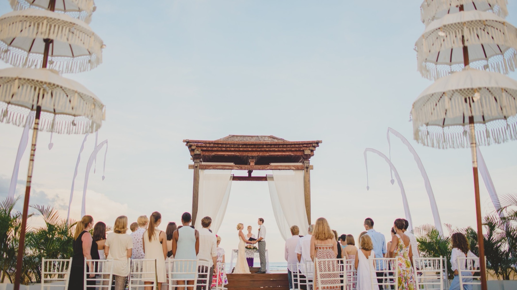 Beach wedding ceremony set up on the sand at Ayodya Resort Bali in Nusa Dua, facing the Indian Ocean