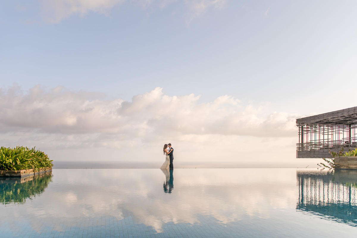 The Cliff-Edge Cabana at Alila Villas Uluwatu, an open-air ceremony pavilion over the Indian Ocean at sunset