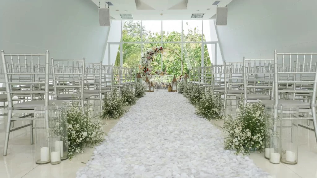 The glass-framed clifftop wedding chapel at Cross Bali Breakers above Balangan Beach on Bali's Bukit peninsula