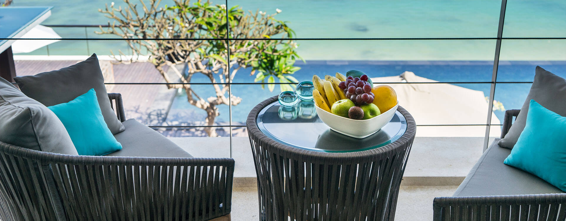 The cliff-edge terrace and infinity pool at Grand Cliff Nusa Dua looking out over the ocean and beach