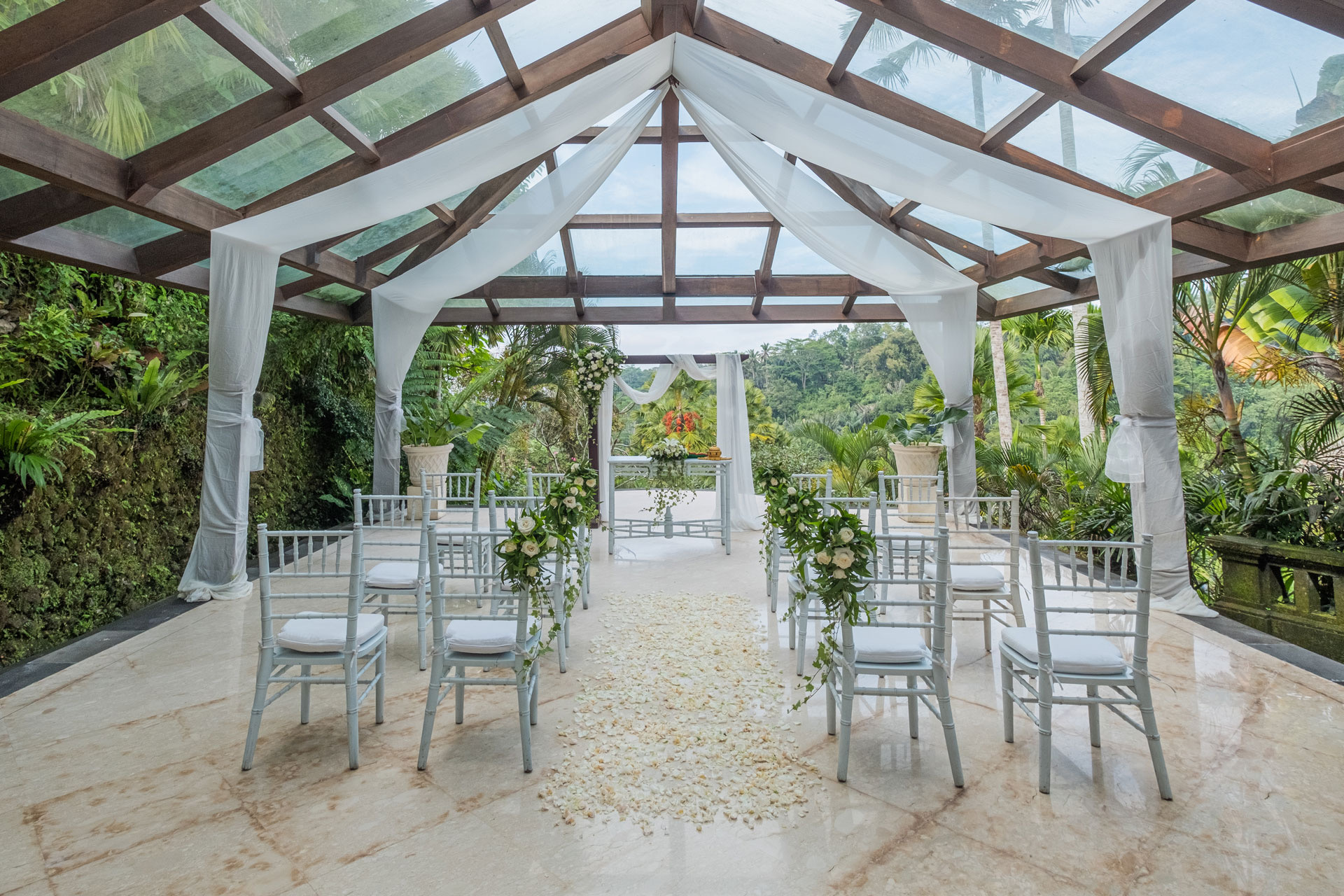 A wedding ceremony at The Royal Pita Maha in Kedewatan, Ubud, in a garden setting elevated over the Ayung River valley