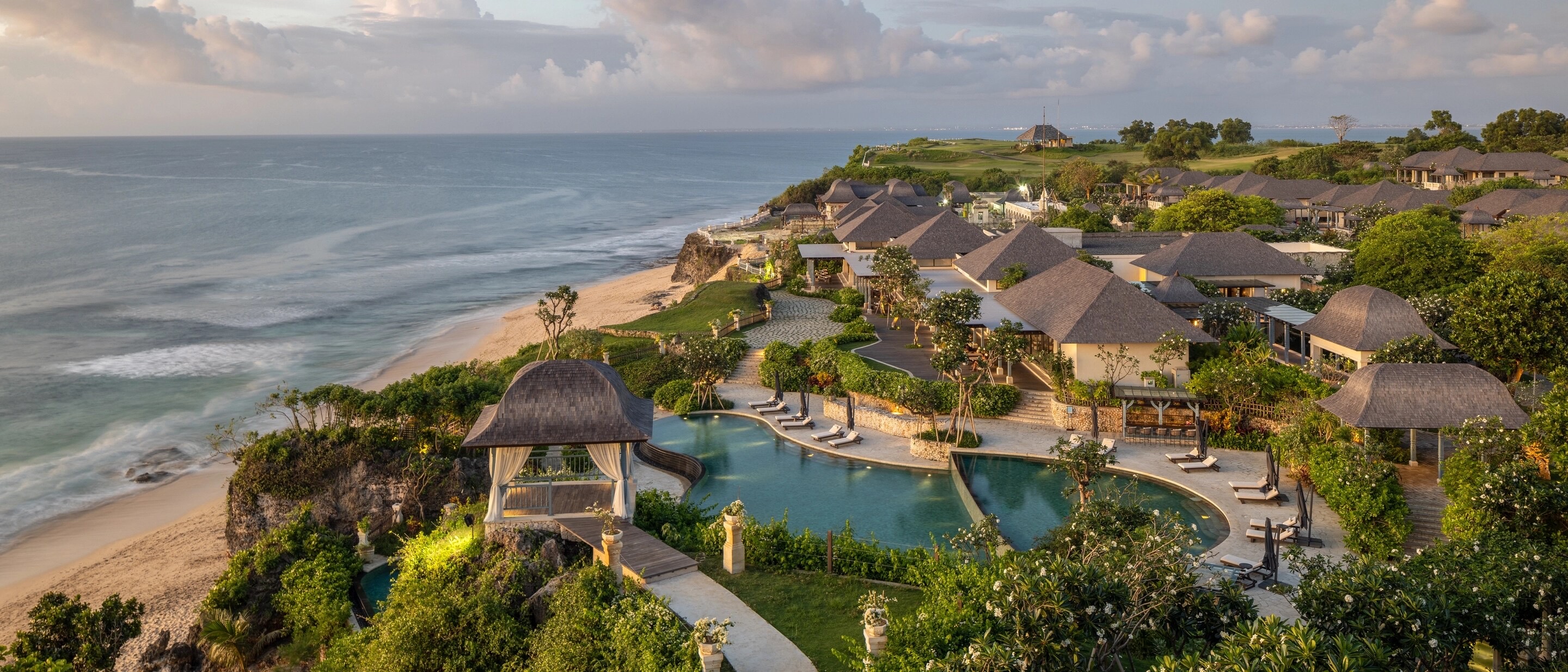 Jumeirah Bali's water-palace architecture and pools on the Uluwatu cliffs above Dreamland Beach