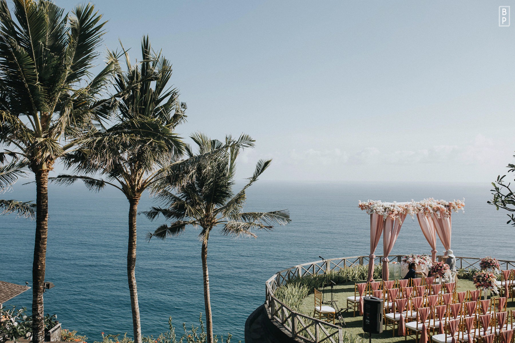 The cliff-front lawn and ocean view at Khayangan Estate, a private wedding venue in Uluwatu, Bali