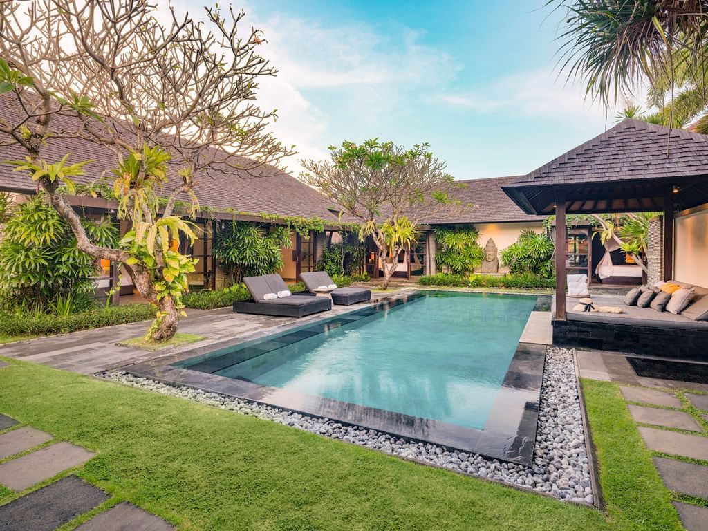 A private-pool villa at Peppers Seminyak, the pool and tropical garden of the Petitenget resort