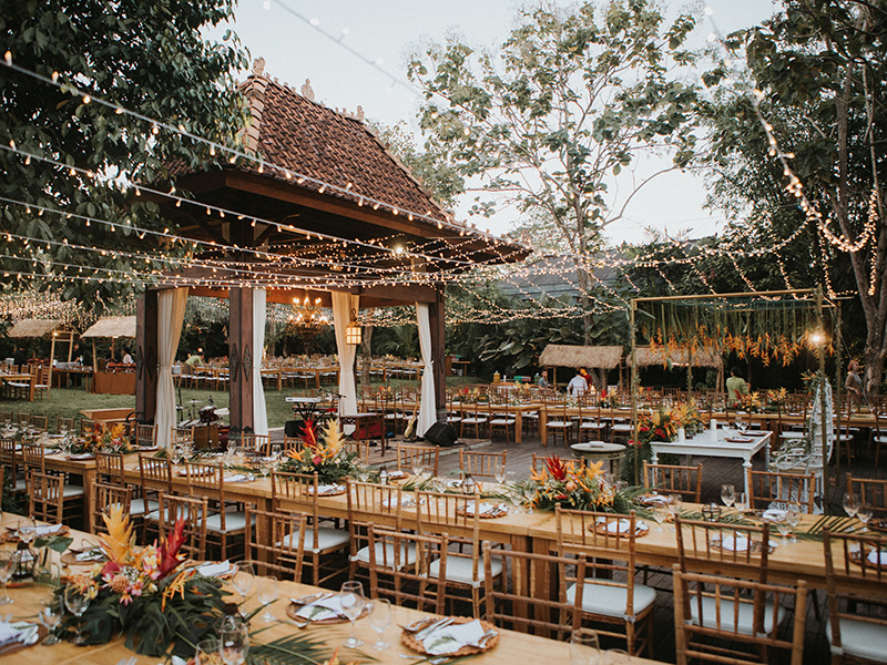 Garden wedding setting at Plataran Canggu, with the traditional Joglo house and tropical planting