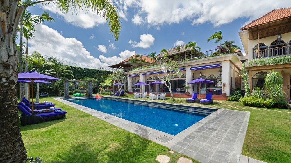 The Moroccan-inspired facade and tropical garden of Sayang d'Amour villa in Petitenget, Seminyak