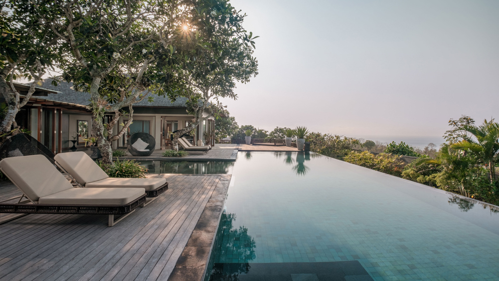 The main ocean-view pool and lawn at The Shanti Residence on the Sawangan hillside in Nusa Dua