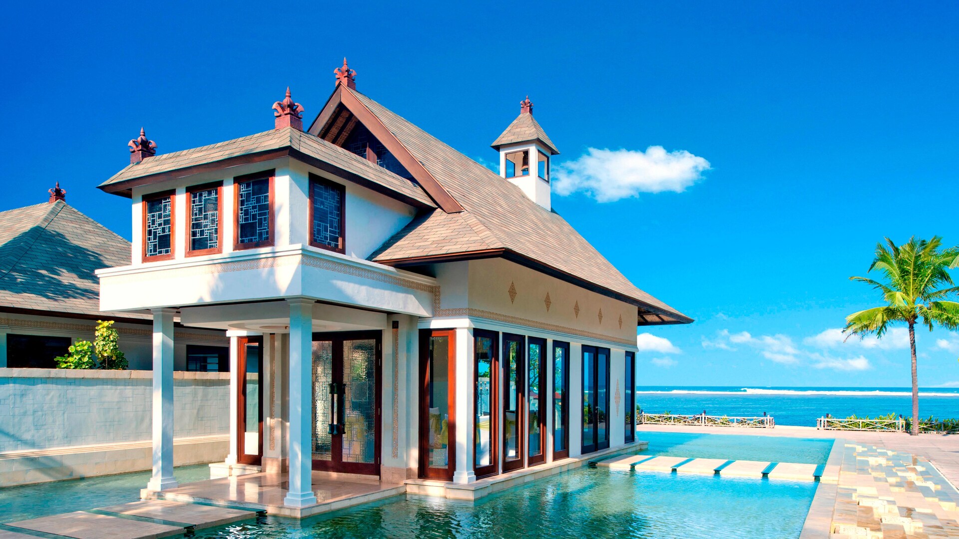The glass Cloud Nine Chapel set over a lagoon at The St. Regis Bali Resort in Nusa Dua