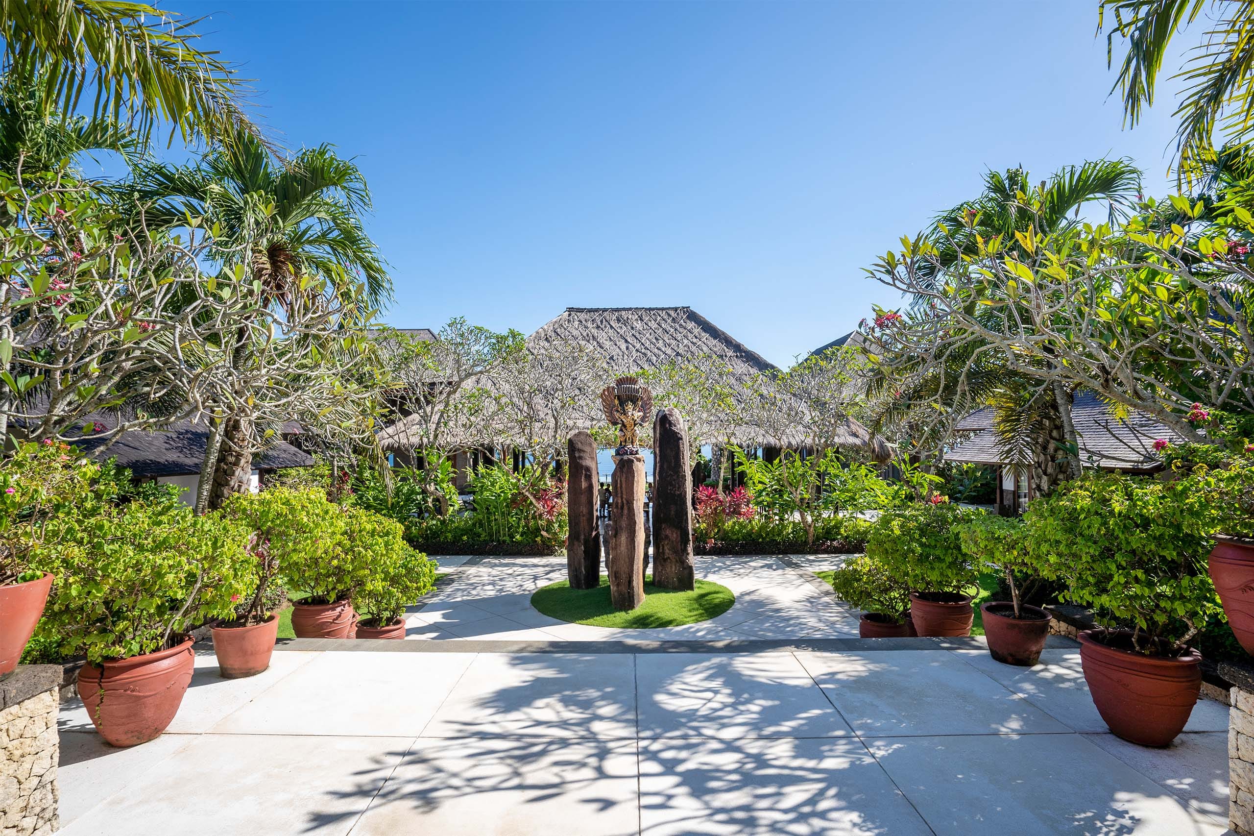 Stone Villas Uluwatu clifftop lawn and pool above the Indian Ocean on the Bukit Peninsula, Pecatu