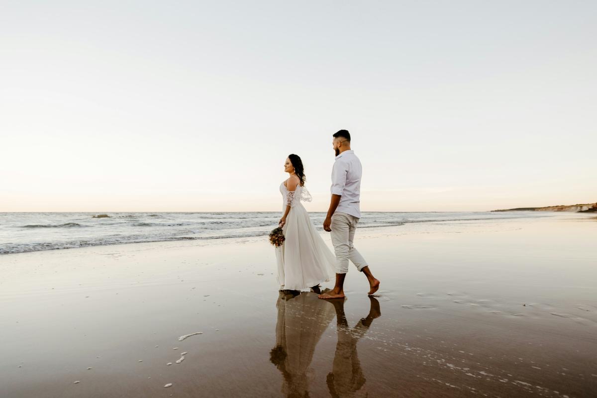 Beachfront wedding setting at Swarga Suites Bali Berawa, with the pool and suites facing Berawa beach and the sunset