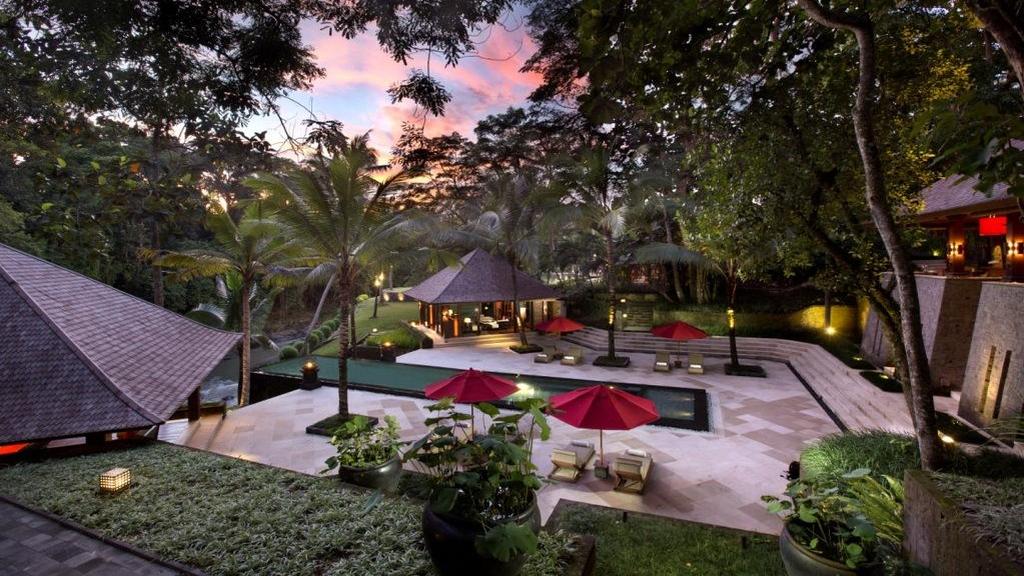 The garden and swimming pool at The Sanctuary Bali, a riverside wedding estate near Canggu
