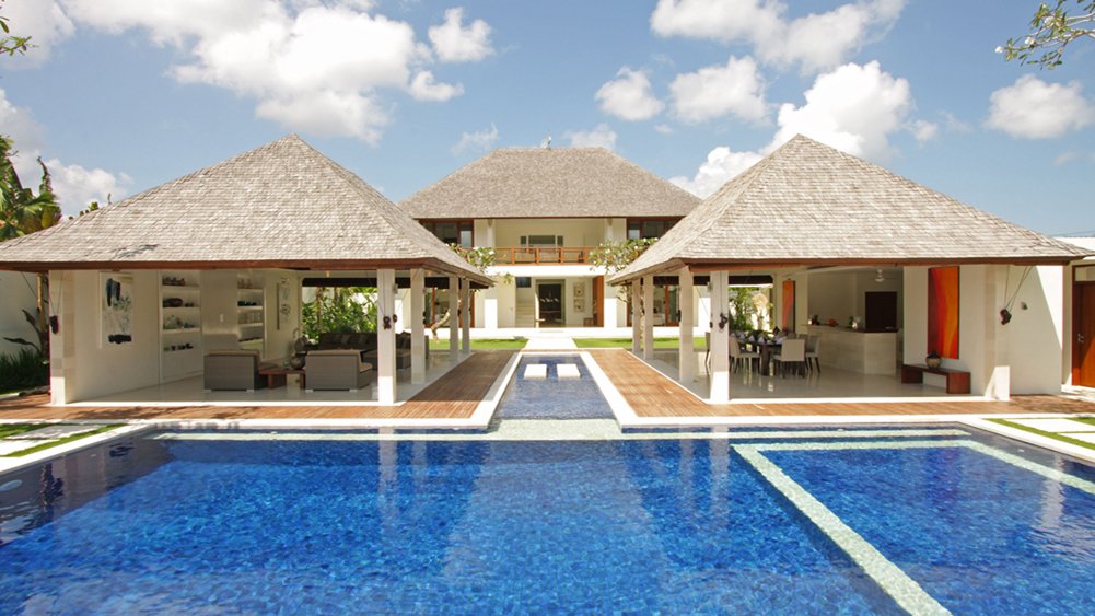 Villa Asante's pool and open pavilions nestled among tropical gardens near Echo Beach, Canggu