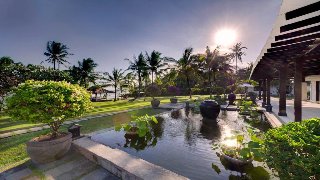 Villa Kailasha's coconut-grove garden and lawn, view toward the covered terrace