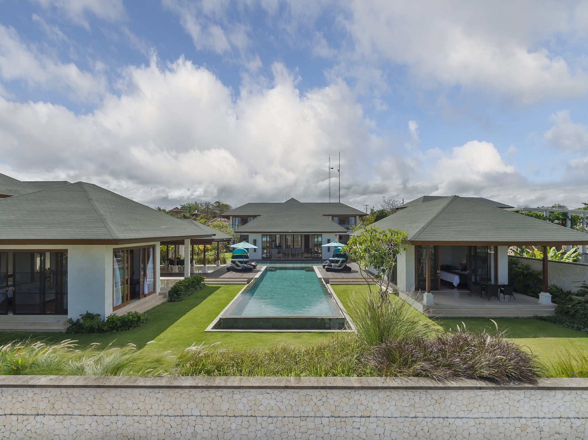 Pavilions and a long lap pool set in the lawns of Villa Marie at Pandawa Cliff Estate, Ungasan
