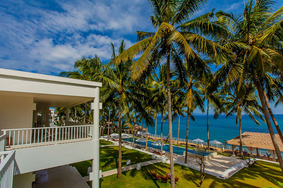 Aerial view of Villa Stella's garden, pool, and private beach on Amuk Bay, Candidasa